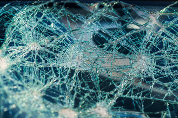 Crushed front window of a small car.