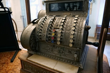 Old mechanical cash register in an old pharmacy. Antique cash register