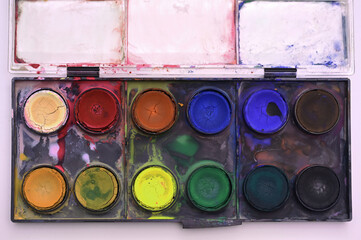 colorful paints, watercolor sets, brushes