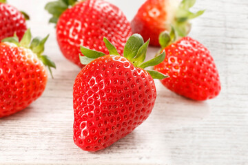 Strawberries on white wooden background, copy space.