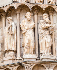 Stone carvings of saints adorning the archways of the Burgos Cathedral in Spain