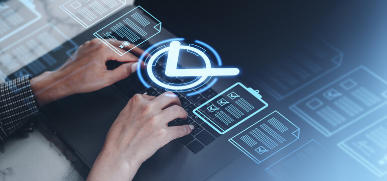 Hands typing on a laptop with holographic icons of documents and a clock on a blurred background, representing digital task management