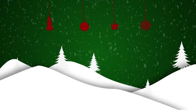 Red ornaments hang above snowy hills and green trees.