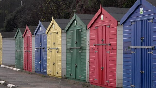 South coast of England beach huts for vacation in leisure time. Dawlish beach for thatcher's UK 4K
