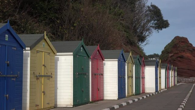 South coast of England beach huts for vacation in leisure time. Dawlish beach for thatcher's UK 4K