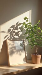 Fototapeta premium Blank minimalist picture frame on shelf with clean, modern interior design