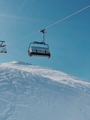 Ski Lift Over Snow-Covered Slopes on a Sunny Day