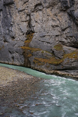 Close-up View of a River Curving Around Rocky Cliffs in a Swiss Gorge
