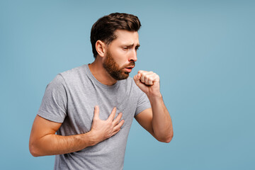 Portrait of sick, upset Hispanic man cough, having virus, cold. Treatment, health care concept