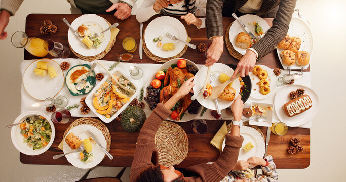Above, dinner and festive with family and food for celebration, support and thanksgiving holiday. Catering, nutrition and reunion with meal and people at home for eating, hosting and health together