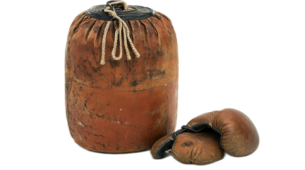Vintage leather boxing equipment featuring a traditional heavy bag and a pair of worn boxing gloves, perfect for sports enthusiasts and fitness lovers seeking retro inspiration.
