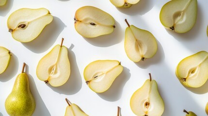 Freshly sliced yellow apples arranged creatively on a light background during a kitchen setup