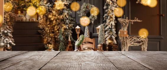 Empty table in room decorated for Christmas, bokeh effect. Banner design