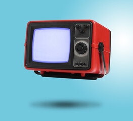 Retro TV set in air on light blue background