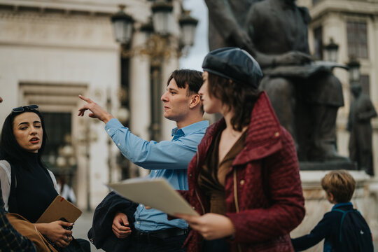 A group of business professionals engage in a lively discussion outdoors, showcasing teamwork and collaboration in an urban environment with architectural elements in the background. - Powered by Adobe