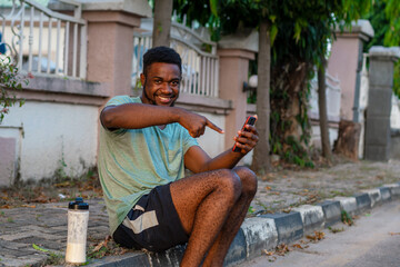 young african man using mobile phone