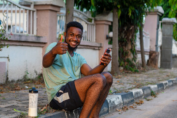 young african man using mobile phone