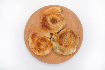Burek - a delicious pie on a wooden plate
