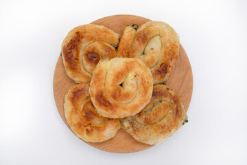 Burek - a delicious pie on a wooden plate