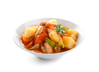 Bowl with delicious beef stew and parsley on white background