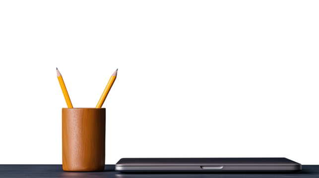 Yellow pencils in wooden holder next to sleek laptop on transparent background
