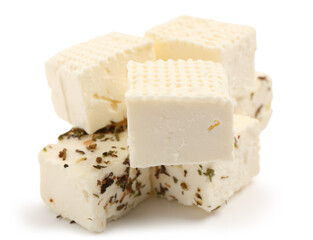 Tasty cut feta cheese and spices on white background