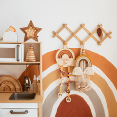 children's room in scandinavian style. canopy in the interior, storage of toys