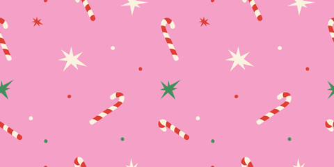 Cute Christmas seamless pattern with candy cane, stars on pink background for holiday designs.