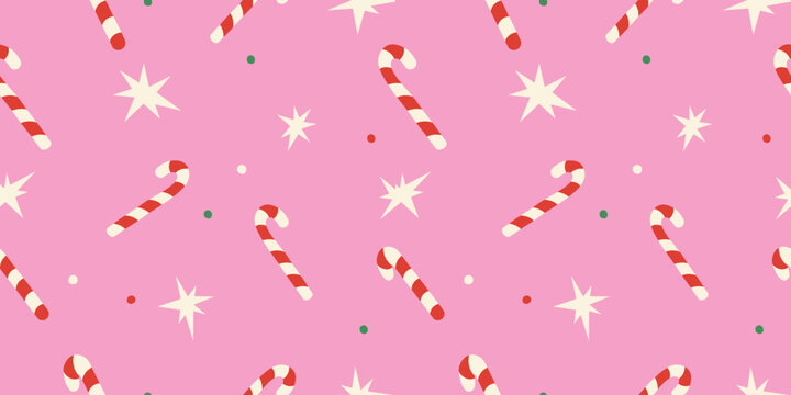Cute Christmas seamless pattern with candy cane, stars on pink background for holiday designs.