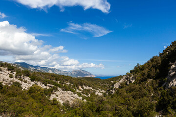 Hiking in Sardinia. Mountains on a hiking trail along the Gulf of Orosei from Cala Luna to Cala Sisine. Beautiful Sardinian landscape.