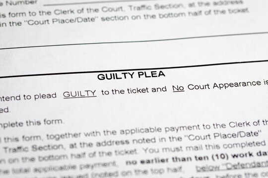 Traffic ticket with guilty plea form. Traffic citation, fine and court concept.