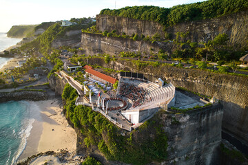 The amphitheater of the local show Kecak Dance at Melasti Beach over a cliff near the ocean on the island of Bali.