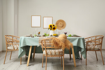 Served dining table with beautiful sunflowers, floral decor and candles