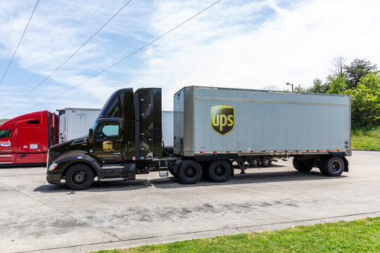 Rest stop on I-40,  May : UPS short trailer truck in parking lot.