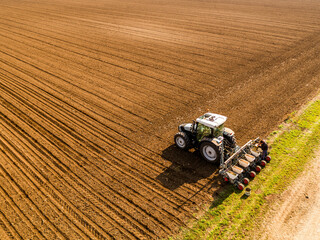Tractor seeding in cultivated field, precision agriculture at its best