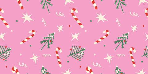 Cute Christmas seamless pattern with candy cane, stars, trees on pink background for holiday designs.
