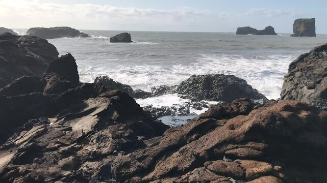waves crashing on rocks on the coast