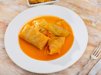 Russain traditional dish, golubtsy (cabbage rolls), served on table.