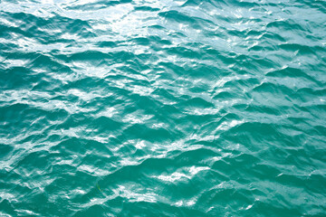 Ocean surface. Blue water texture. Close up blue water surface. Sea surface aerial view. Blue ocean surface. Blue water. Pattern texture.