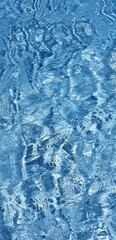 Blue water surface ripples