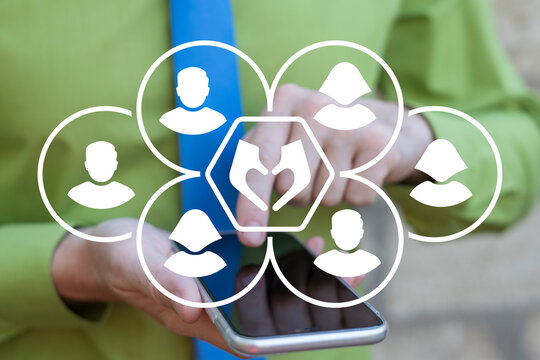 Business person holding phone and using virtual touchscreen sees icon symbolizing love: hands making heart shape gesture. Acquaintance, love, romance, friendship concept. Love everything.