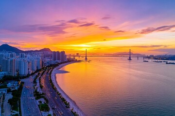 A stunning aerial shot of a river running through a major city, with bridges connecting the urban landscape
