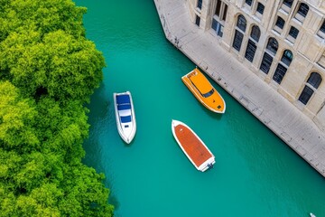 A top-down view of a city's waterfront area with docked boats and lively activity on the boardwalk