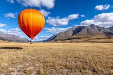 Obraz premium A tranquil scene of a hot air balloon drifting over the Drakensberg Mountains