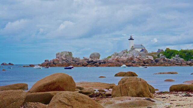 Small motor boats and yachts anchored in the bay, Phare de Pontusval, Brittany, France. Timelapse