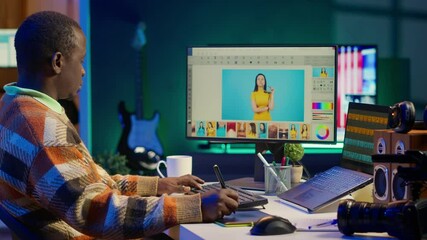 Creative african american graphic designer editing images on dual monitors, showcasing talent and dedication to the digital design field in a well organized home workspace. Camera A. - Powered by Adobe