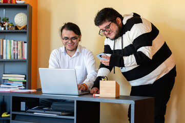 Fototapeta premium Two young men working from home