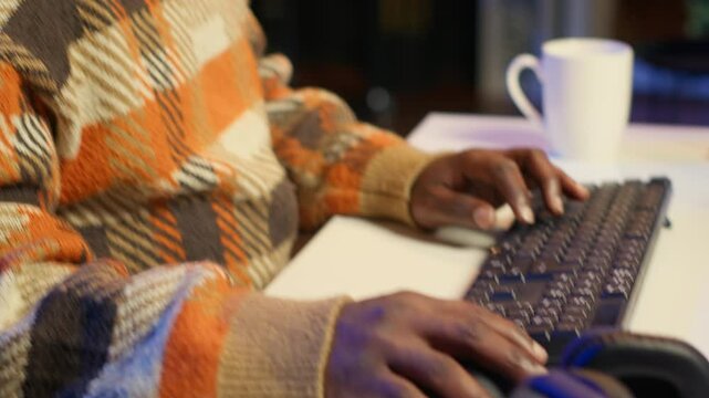 Professional developer manages neural network at desk working with AI code on laptop. African american IT expert freelancer developing cyber security, creating secure database. Close up. Camera A.