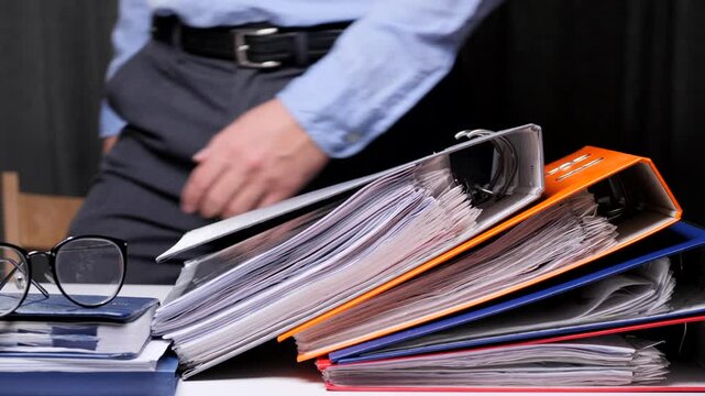 concept of bureaucracy, many documents, certificates, binders. Hard work