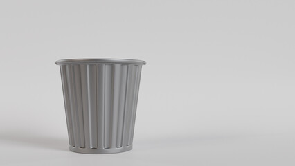 An empty metal trash can on a white background, representing simplicity and cleanliness. Ideal for graphic design projects, websites, blogs, educational materials, environmental awareness campaigns.